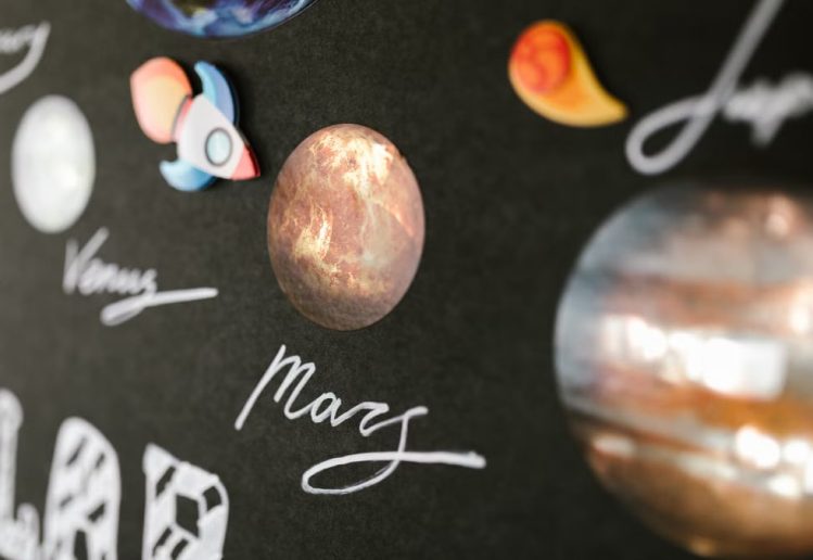 Creative depiction of the solar system planets for school project on a dark background.