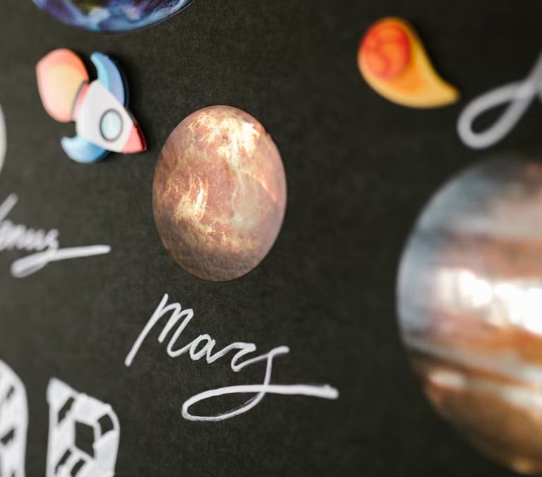 Creative depiction of the solar system planets for school project on a dark background.
